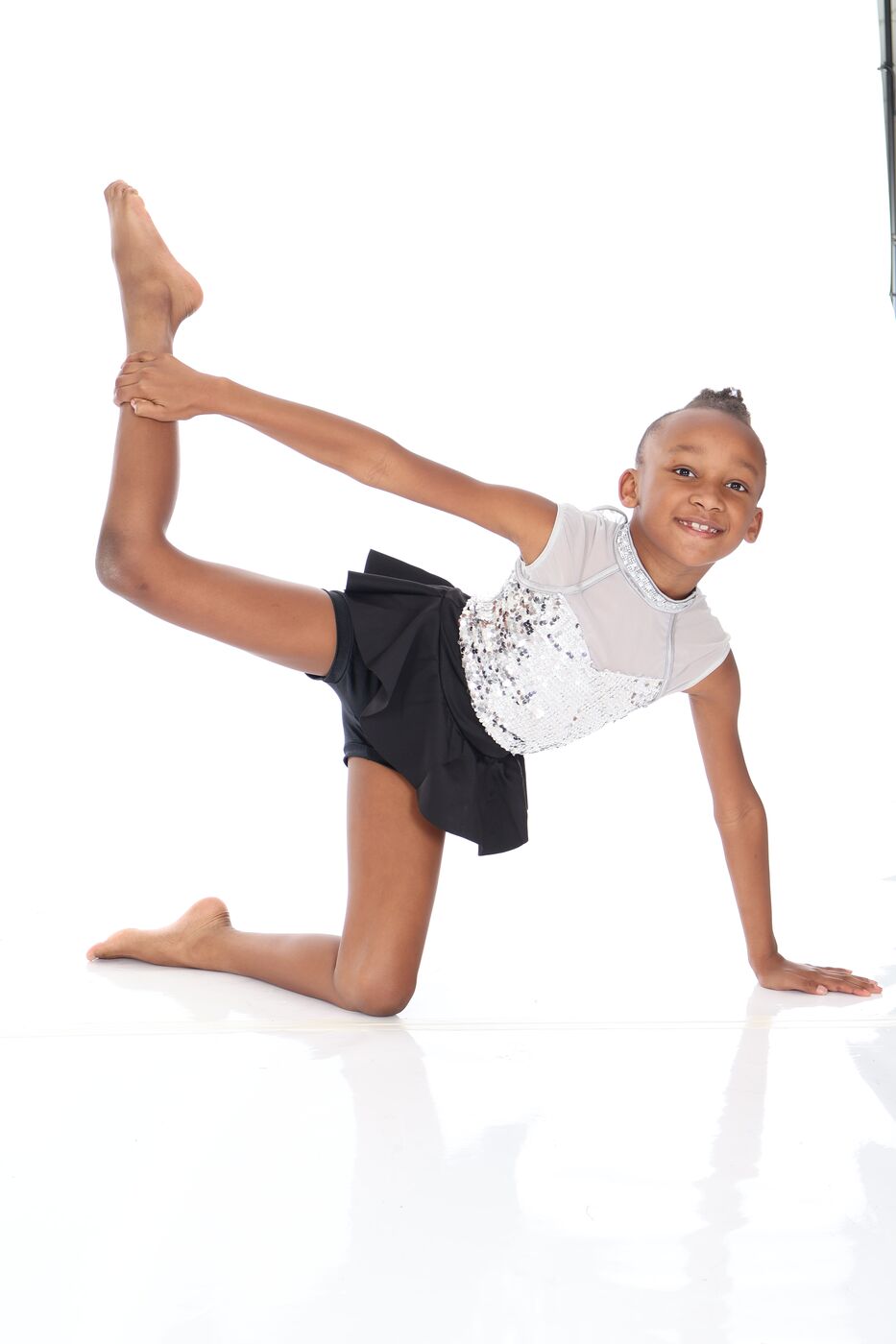 Dance Makers dancer holding a flexible acro pose