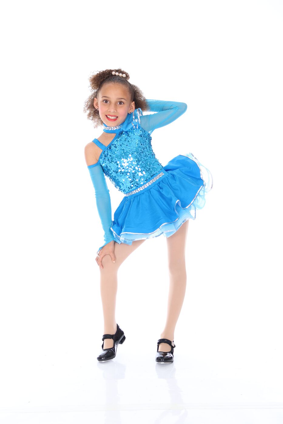 Dance Makers dancer in a blue sequin costume and tap shoes