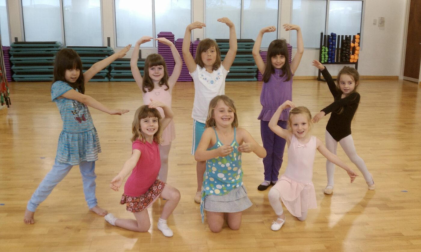 Children posing in ballet positions during a Dance Makers studio dance class in Virginia Beach